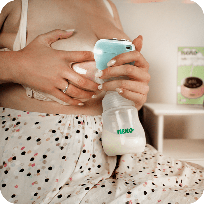 neno angelo breast pump drawing milk from the woman's breast