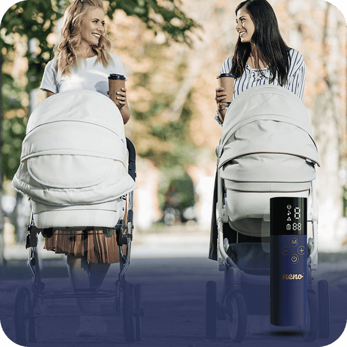 Two women with coffees in their hands and pushing a stroller