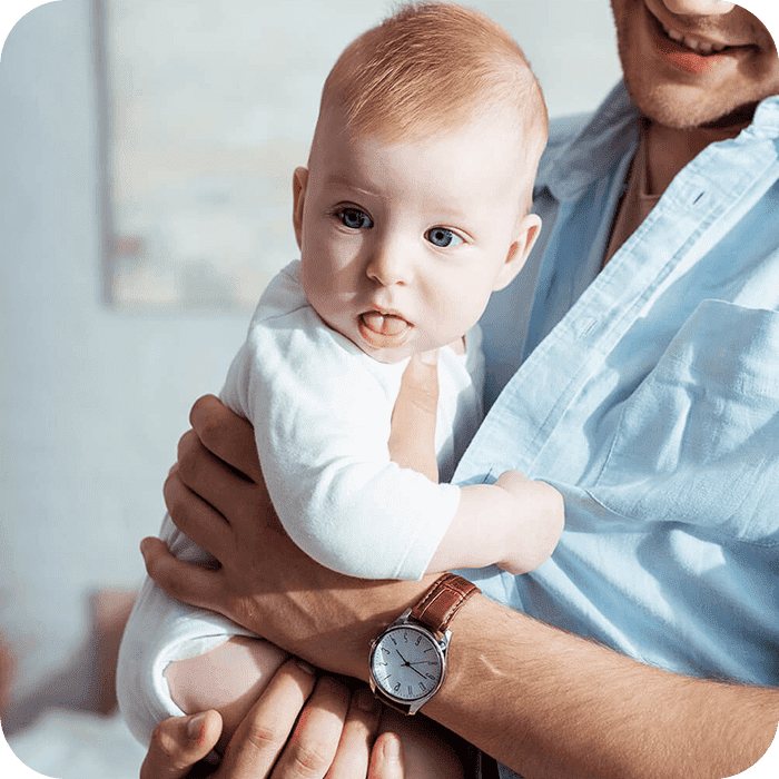 Father holding baby in his arms