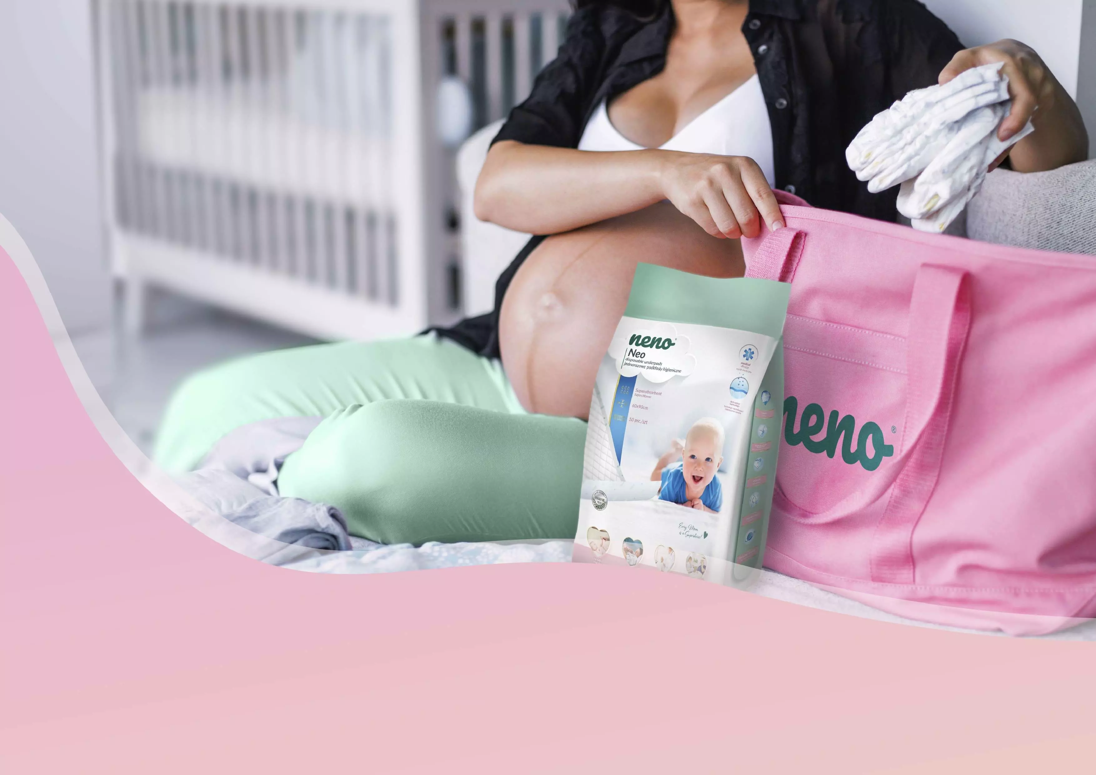 pregnant woman putting underpads into Neno bag