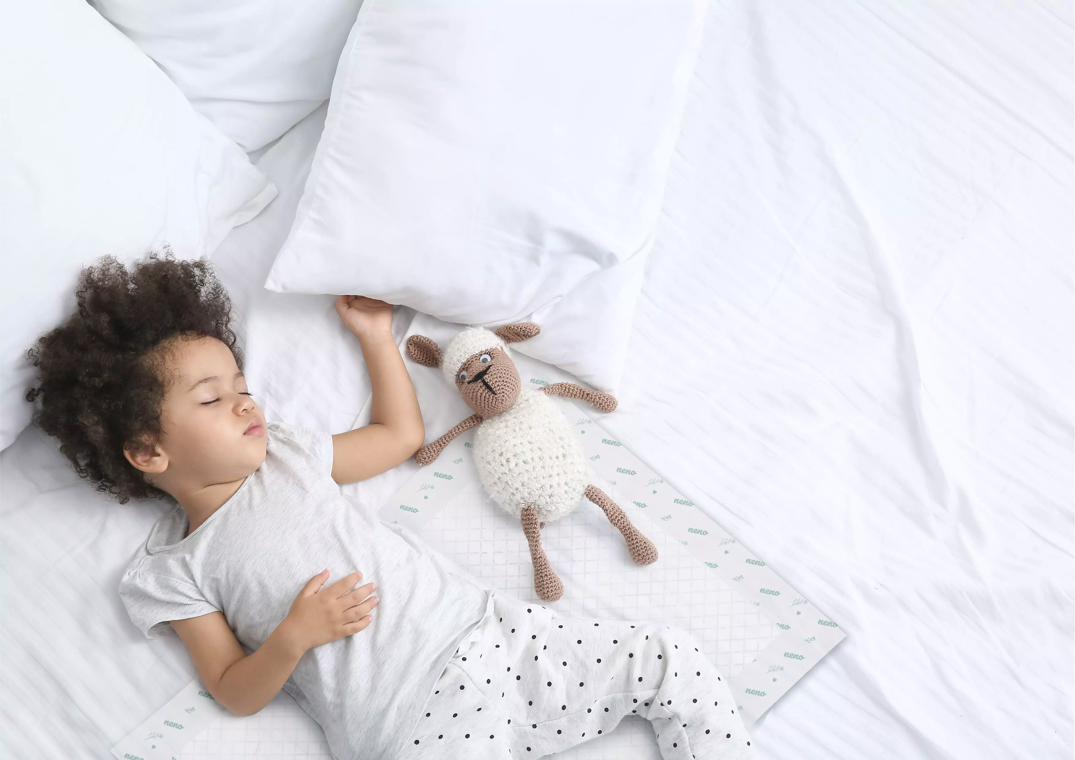 mulatto sleeping with a sheep in a crib